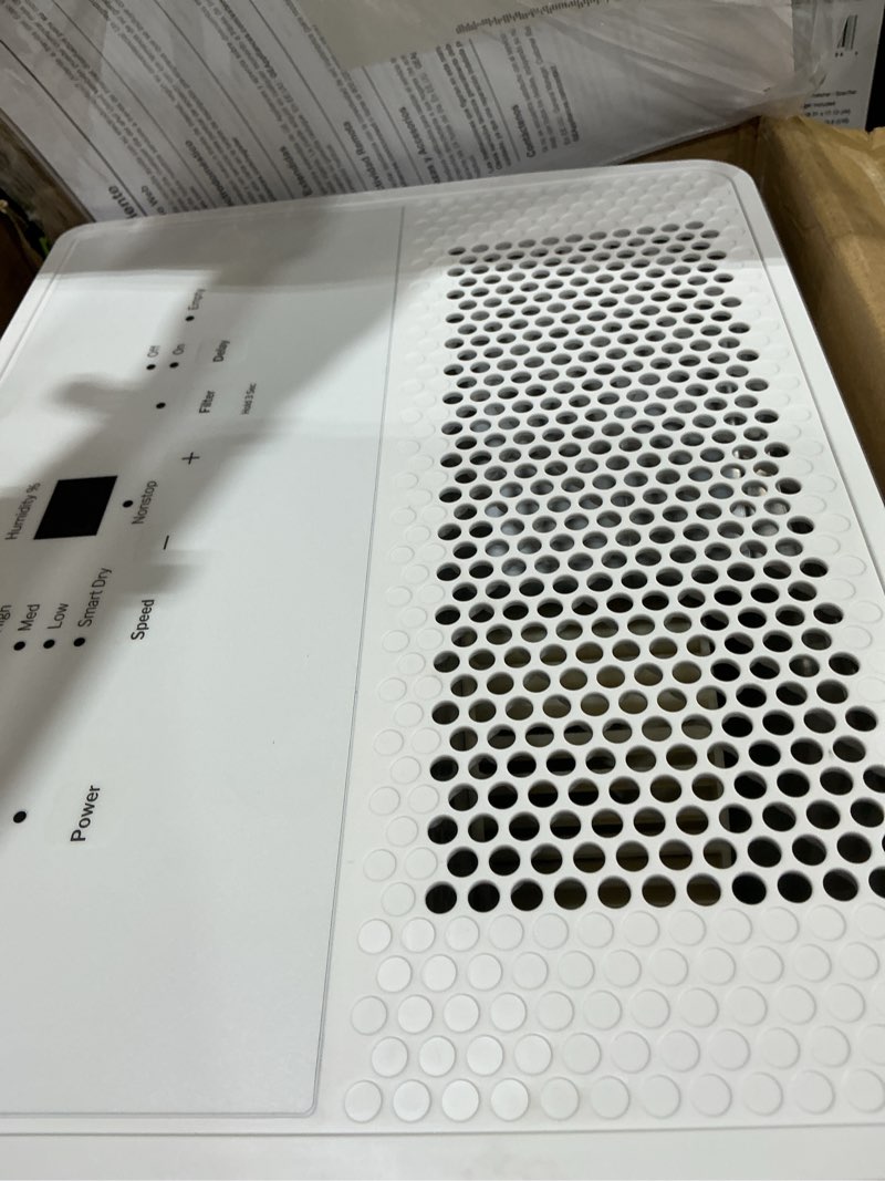 Condition photo showing As Is for ge portable dehumidifier, 50 pint daily output with smart dry for wet spaces, drain hose for auto or manual drainage, ultra quiet, perfect for basement, bedroom, bathrooms, white 50 pint - standard