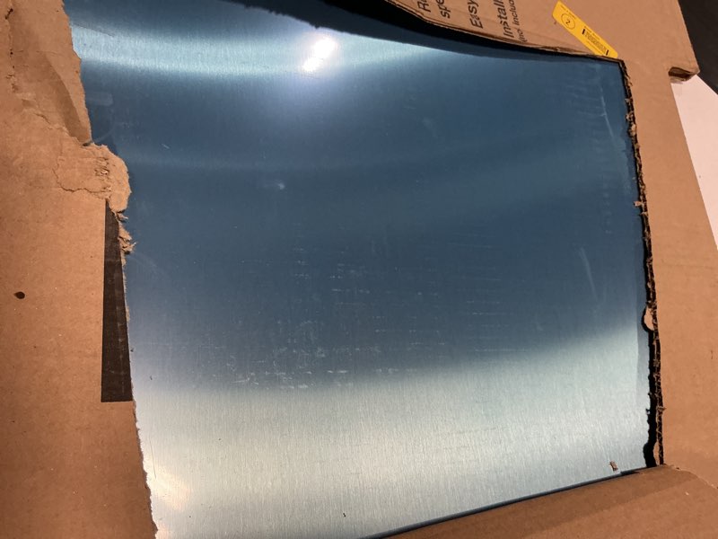 Condition photo showing As Is for broan duct-free universal backsplash plate (stainless steel)