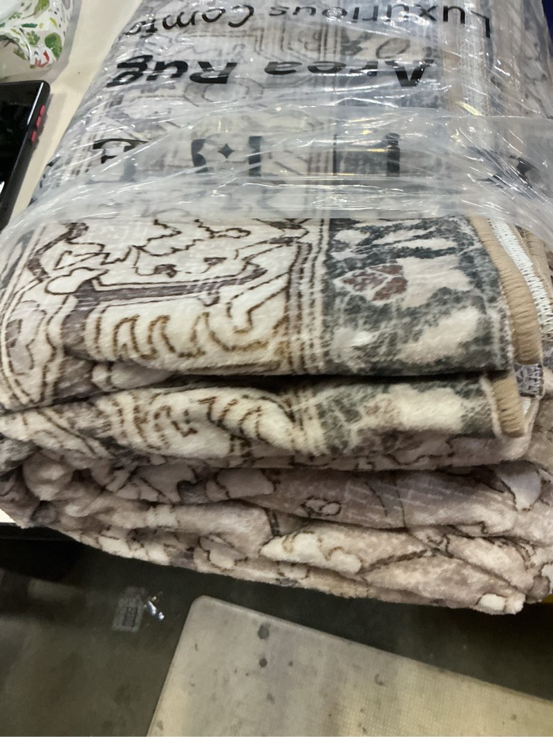 Condition photo showing New/Like New for kuden 5x7 area rug, machine washable area rug with non-slip backing, vintage style, soft, easy clean, low pile rug for living room, bedroom, dining room brown / beige 5' x 7' rectangular