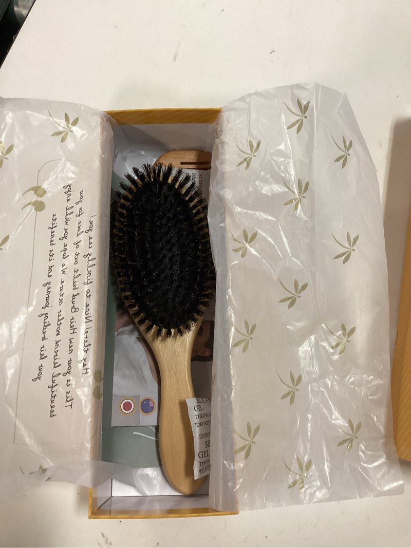 Condition photo showing New/Like New for belula 100% boar bristle hair brush set (medium). soft natural bristles for thin and fine hair. restore shine and texture. wooden comb, travel bag and spa headband included!
