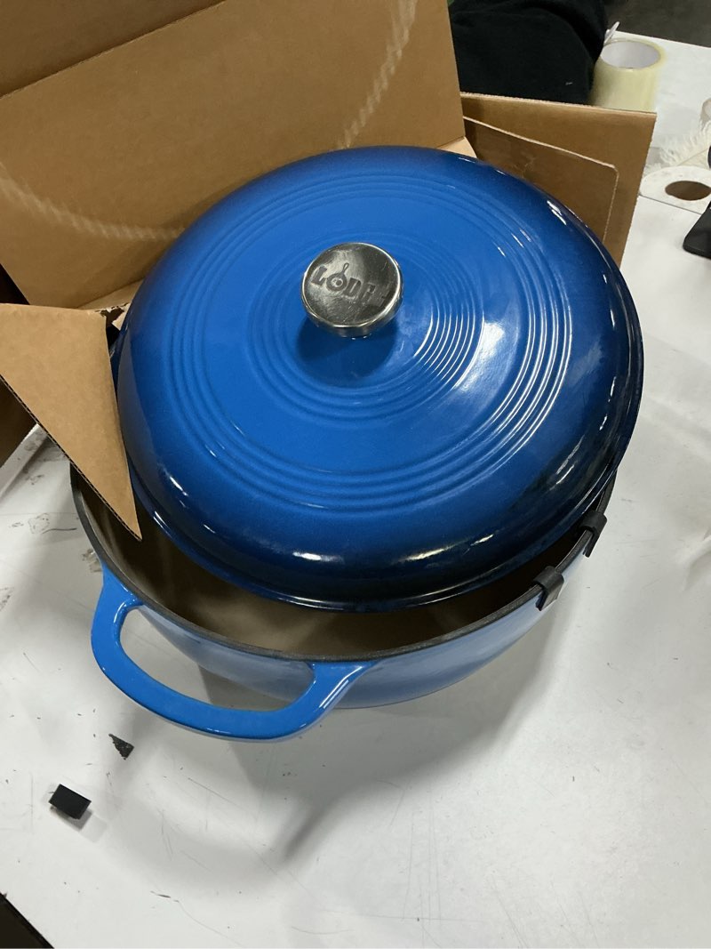Condition photo showing Good Condition for Lodge 6 Quart Enameled Cast Iron Dutch Oven with Lid – Dual Handles – Oven Safe up to 500° F or on Stovetop - Use to Marinate, Cook, Bake, Refrigerate and Serve – Blue