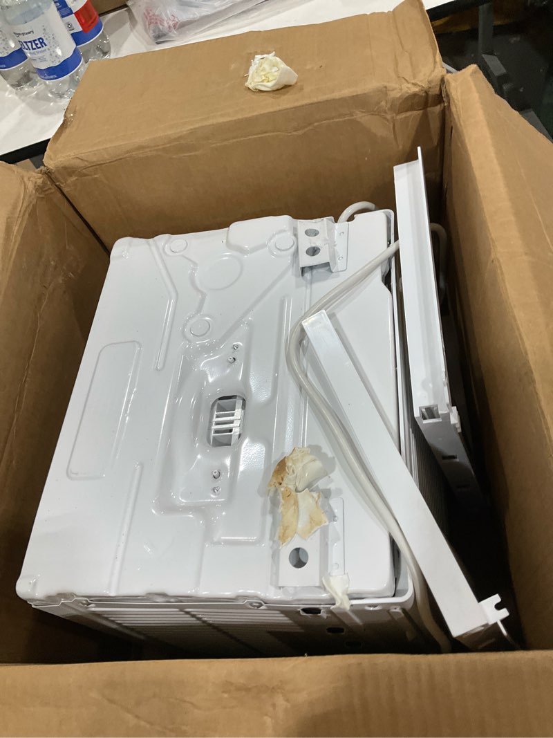 Condition photo showing As Is for amazon basics 5000-btu window air conditioner with quiet operation, up to 150 sqf, cool and fan functions, washable filter, adjustable window kit, intuitive mechanical controls, for small room, white white 5000 btu