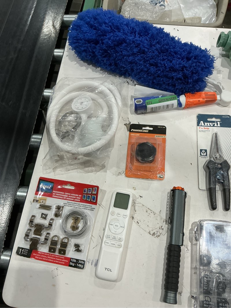 Condition photo showing As Is for assorted home improvement lot (small tools, screw, home accessories, etc.)