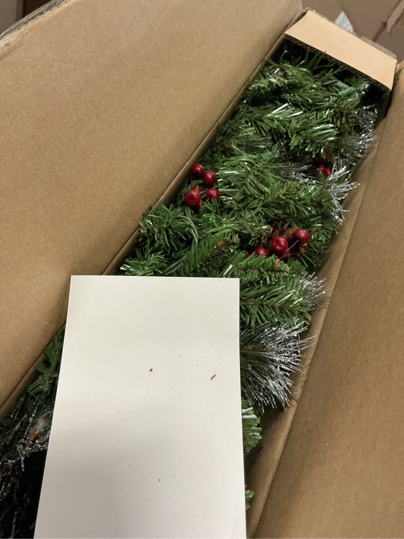 Condition photo showing Good Condition for National Tree Company 9 ft Pre-Lit Crestwood Spruce Artificial Christmas Garland, Christmas Decoration with Glitter, Pinecones, Red Berries, 50 Clear Lights, 180 Tips, Green Plug In Tree