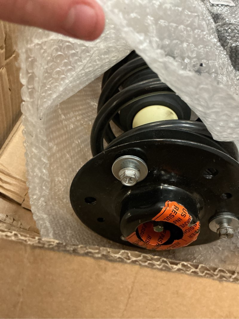 Condition photo showing As Is for struts for vehicle 