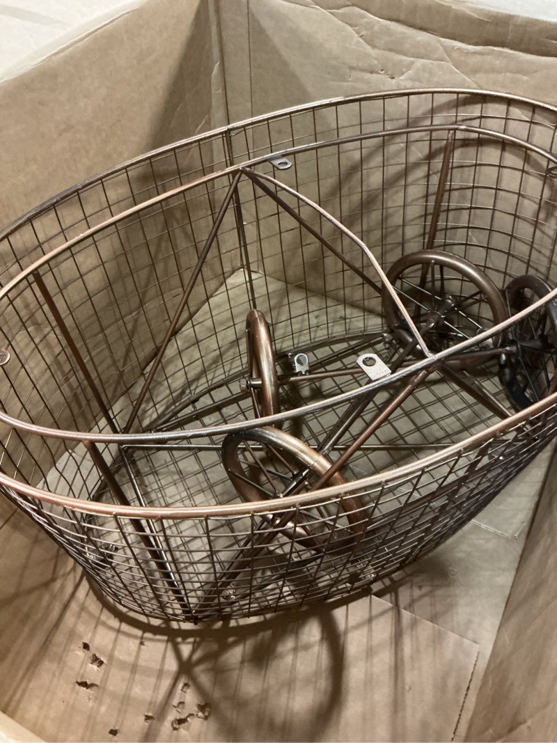 Condition photo showing Good Condition for creative co-op vintage reproduction decorative metal laundry basket on wheels, copper