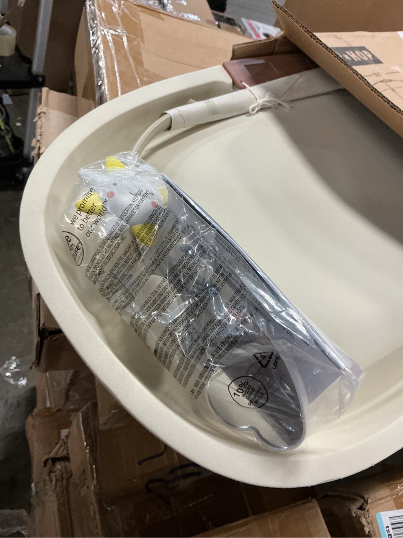 Condition photo showing As Is for skip hop baby changing pad nursery style wipe-clean contoured with cushioned foam, non-skid base, built-in safety belt & tuck-away toy bar fits standard changing tables, oat 16" oat
