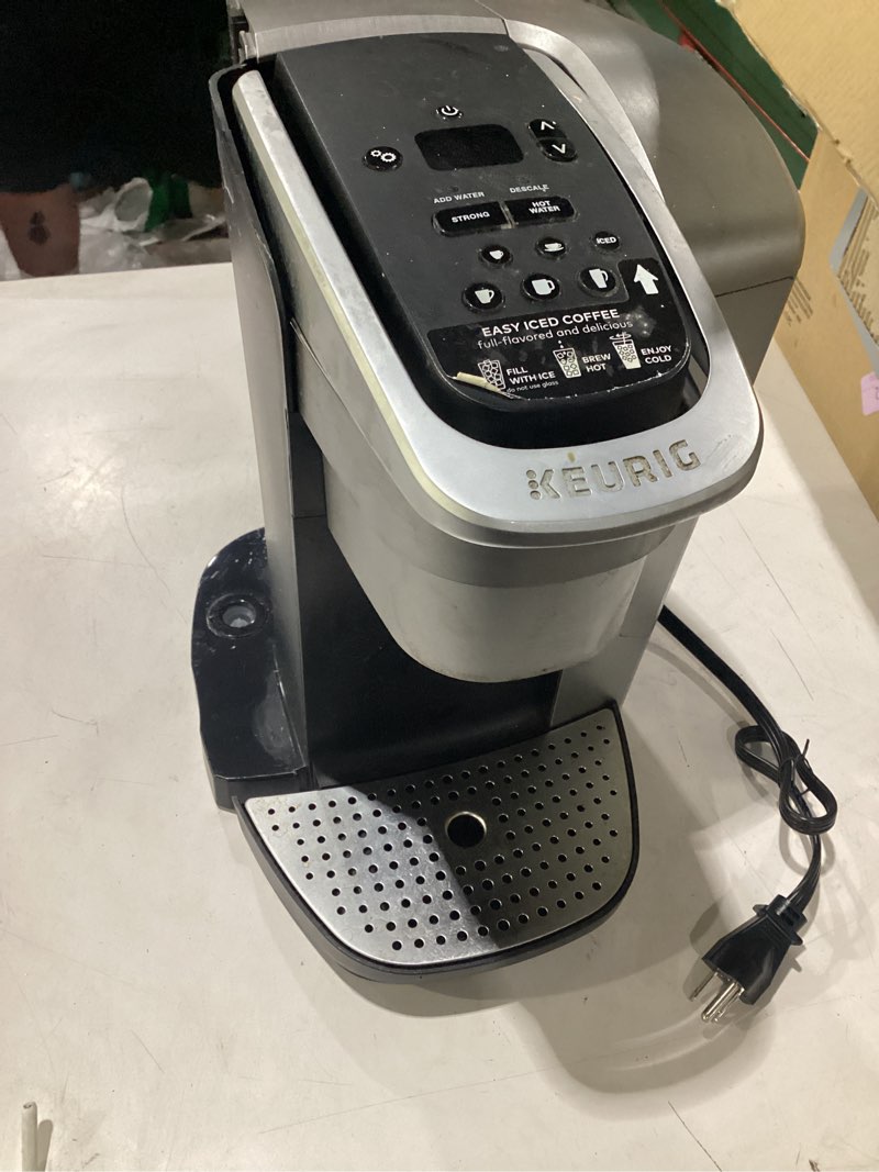 Condition photo showing As Is for **untested** (missing parts) keurig k-elite single serve k-cup pod coffee maker, with strength and temperature control, iced coffee capability, 8 to 12oz brew size, programmable, brushed silver