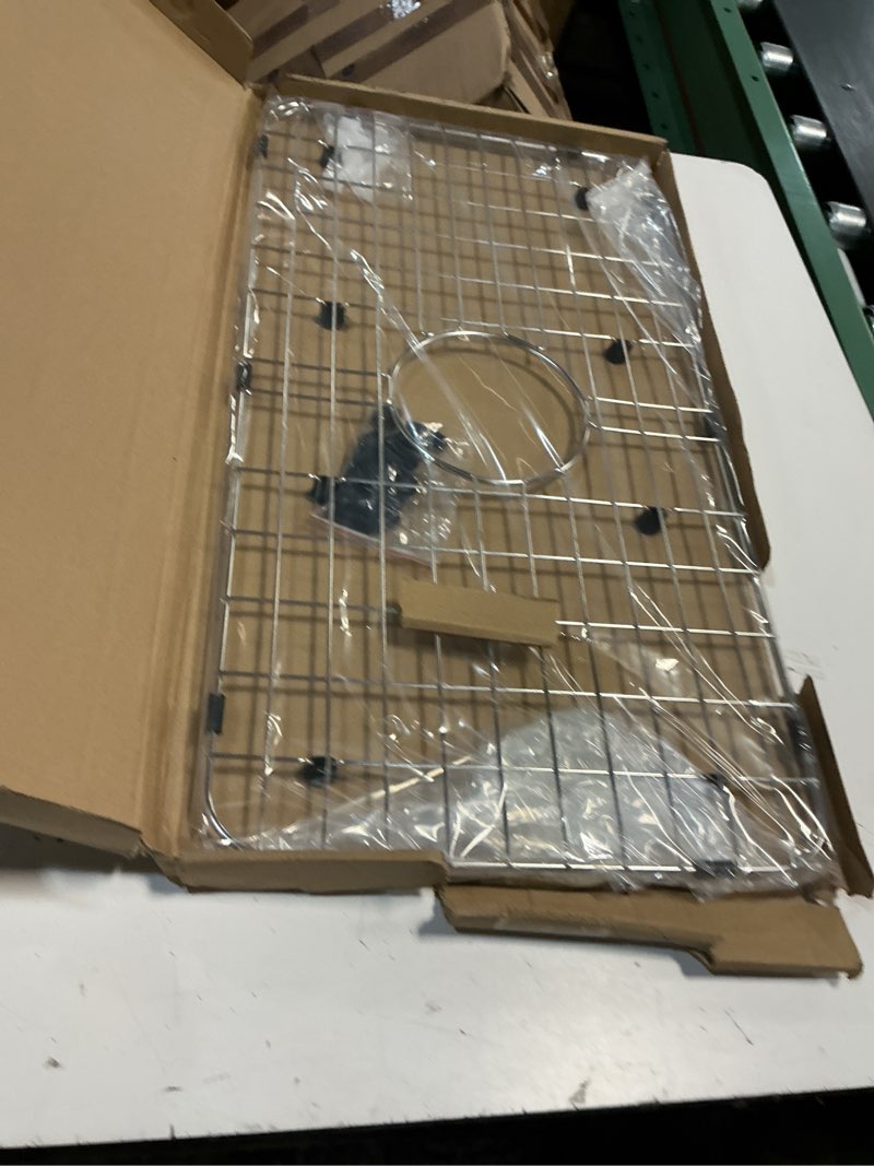 Condition photo showing New/Like New for serene valley sink bottom grid 24-1/8" x 12-5/8", centered drain with corner radius 1-1/2", sink protector nlw2412c
