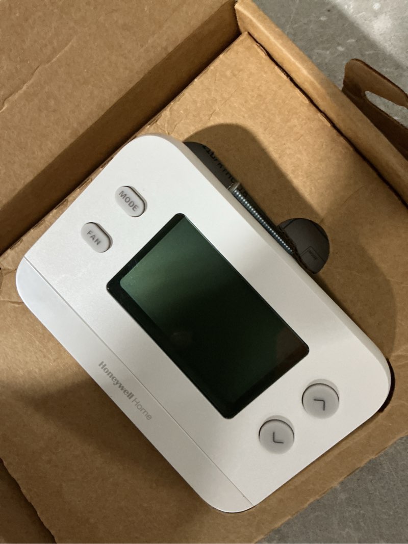 Condition photo showing As Is for honeywell home x1n heating and cooling push button non-programmable thermostat