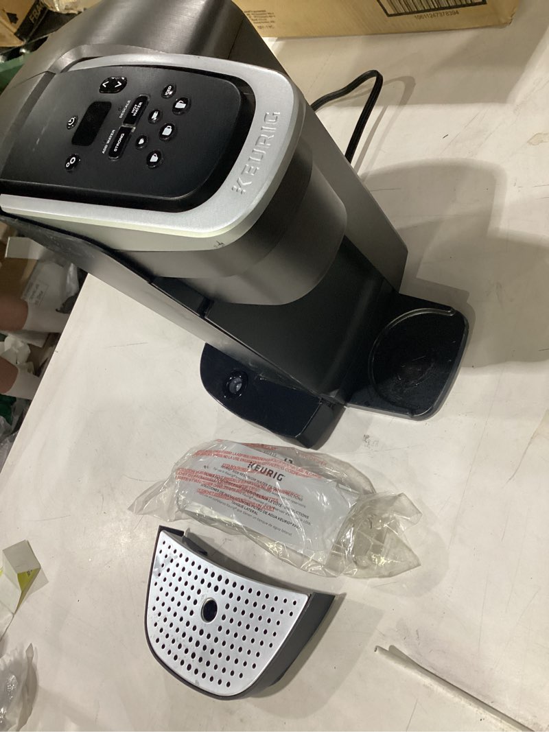 Condition photo showing As Is for **untested** (missing parts) keurig k-elite single serve k-cup pod coffee maker, with strength and temperature control, iced coffee capability, 8 to 12oz brew size, programmable, brushed slate