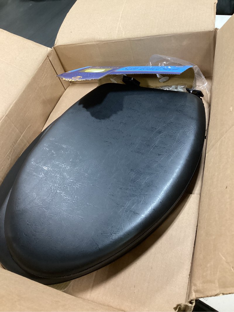 Condition photo showing As Is for Soft Elongated Vinyl Toilet Seat, Black - 19 Inch Soft Vinyl Cover with Comfort Foam Cushioning - Fits All Elongated Size Fixtures - Easy to Install Fantasia by Achim Home Decor Black 19 Inch Vinyl