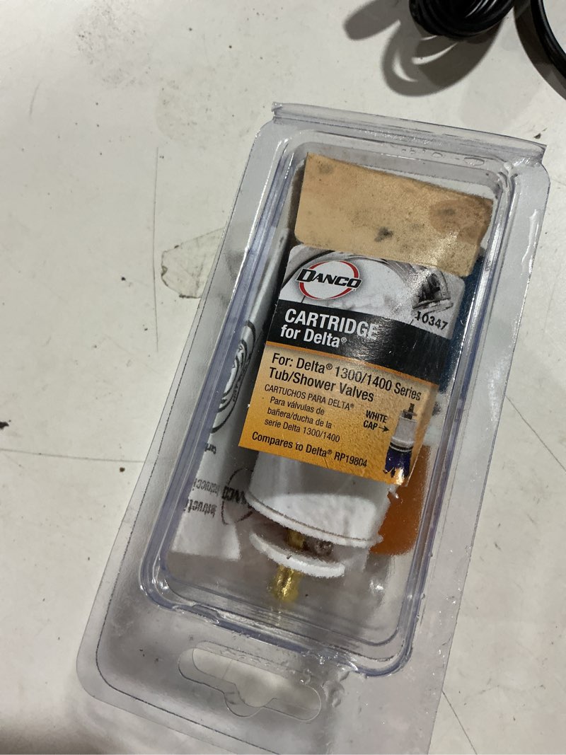 Condition photo showing As Is for danco hot and cold faucet cartridge for delta