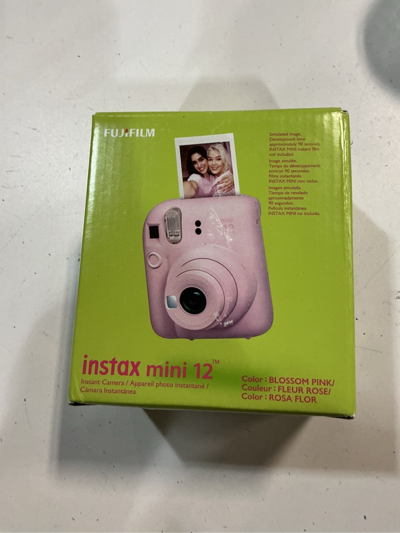 Condition photo showing New/Like New for Fujifilm Instax Mini 12 Instant Camera Blossom Pink + Fuji Film Value Pack (40 Sheets) + Shutter Accessories Bundle, Incl. Compatible Carrying Case, Quicksand Beads Photo Album 64 Pockets