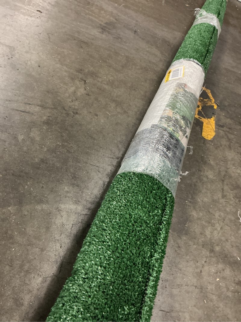 Condition photo showing Good Condition for trafficmaster emerald green precut turf 6 ft. x 8 ft. artificial grass rug