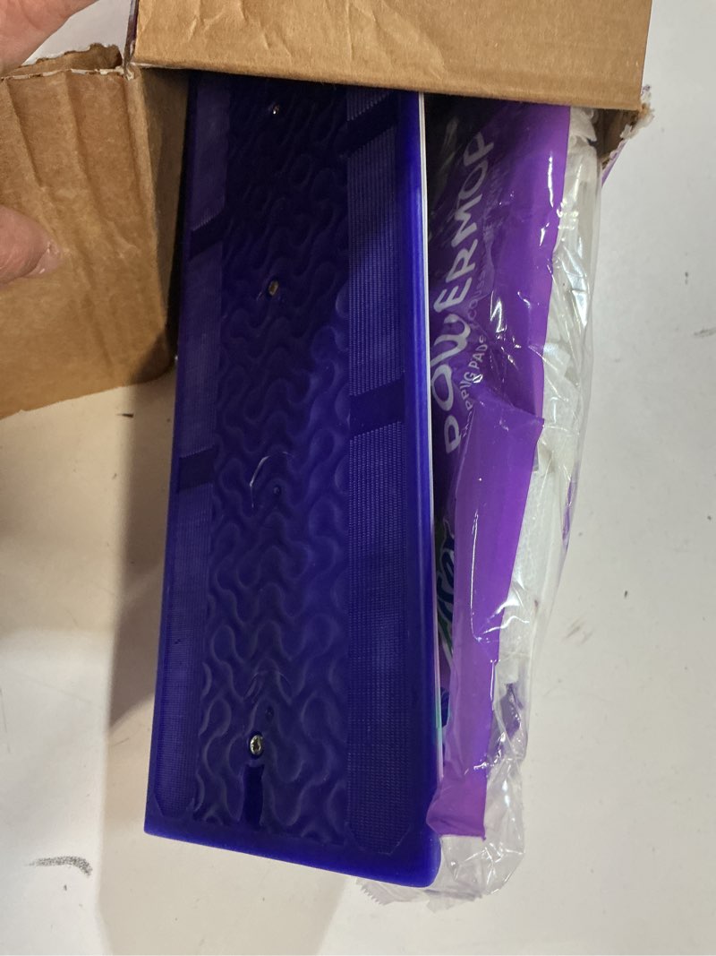 Condition photo showing As Is for swiffer powermop multi-surface mop kit for floor cleaning, includes powermop, 2 mopping pad refills, 1 cleaning solution with fresh scent and 2 batteries purple and white
