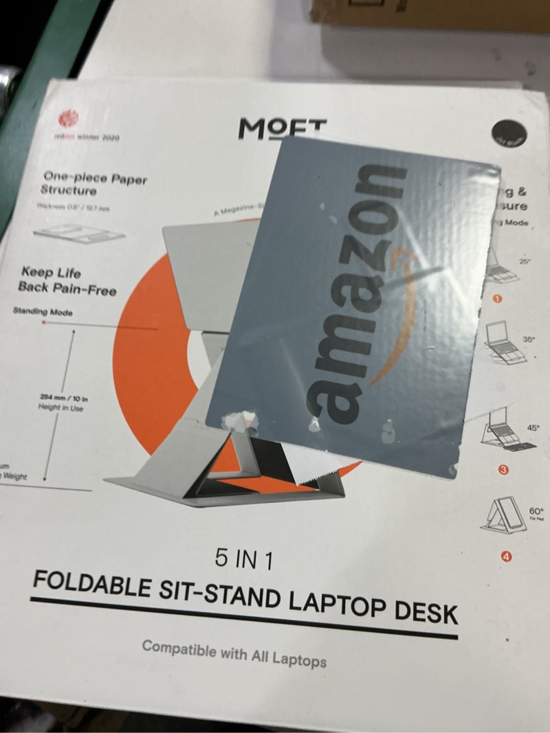 Condition photo showing New/Like New for MOFT Folding Laptop Stand Lap Desk, Portable & Mini Computer Stand Laptop Desk for Travel and Home Office, Ergonomic Design with Adjustable Viewing Angles, Lightweight Computer Cooling Riser, Black