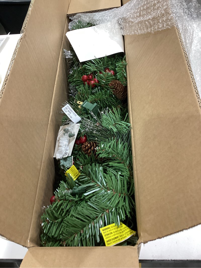 Condition photo showing Good Condition for national tree company 9 ft pre-lit crestwood spruce artificial christmas garland, christmas decoration with glitter, pinecones, red berries, 50 clear lights, 180 tips, green plug in tree