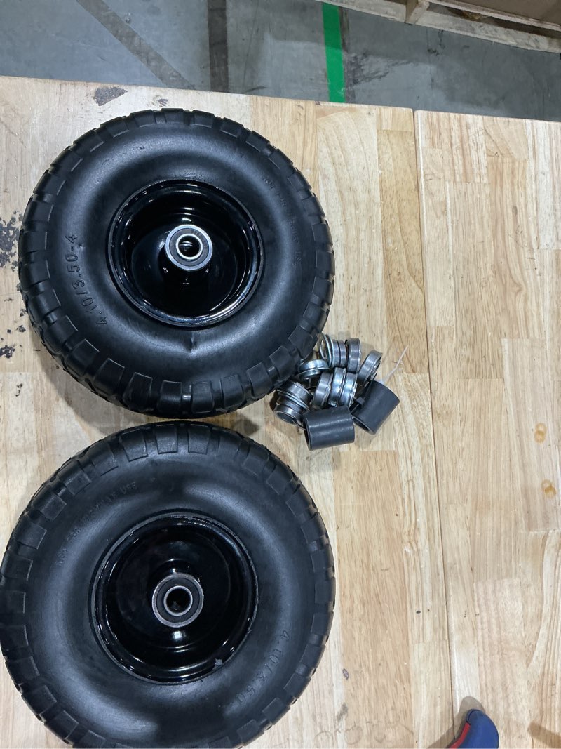 Condition photo showing As Is for 2-pack 10-inch solid tires wheels, 4.10/3.50 black