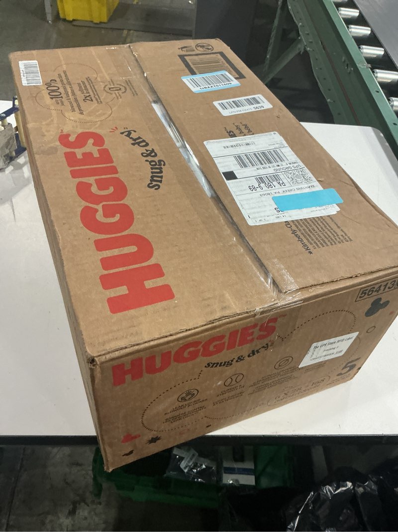Condition photo showing New/Like New for Huggies Size 5 Diapers, Snug & Dry Baby Diapers, Size 5 (27+ lbs), 168 Count (6 Packs of 28), Packaging May Vary Size 5 168