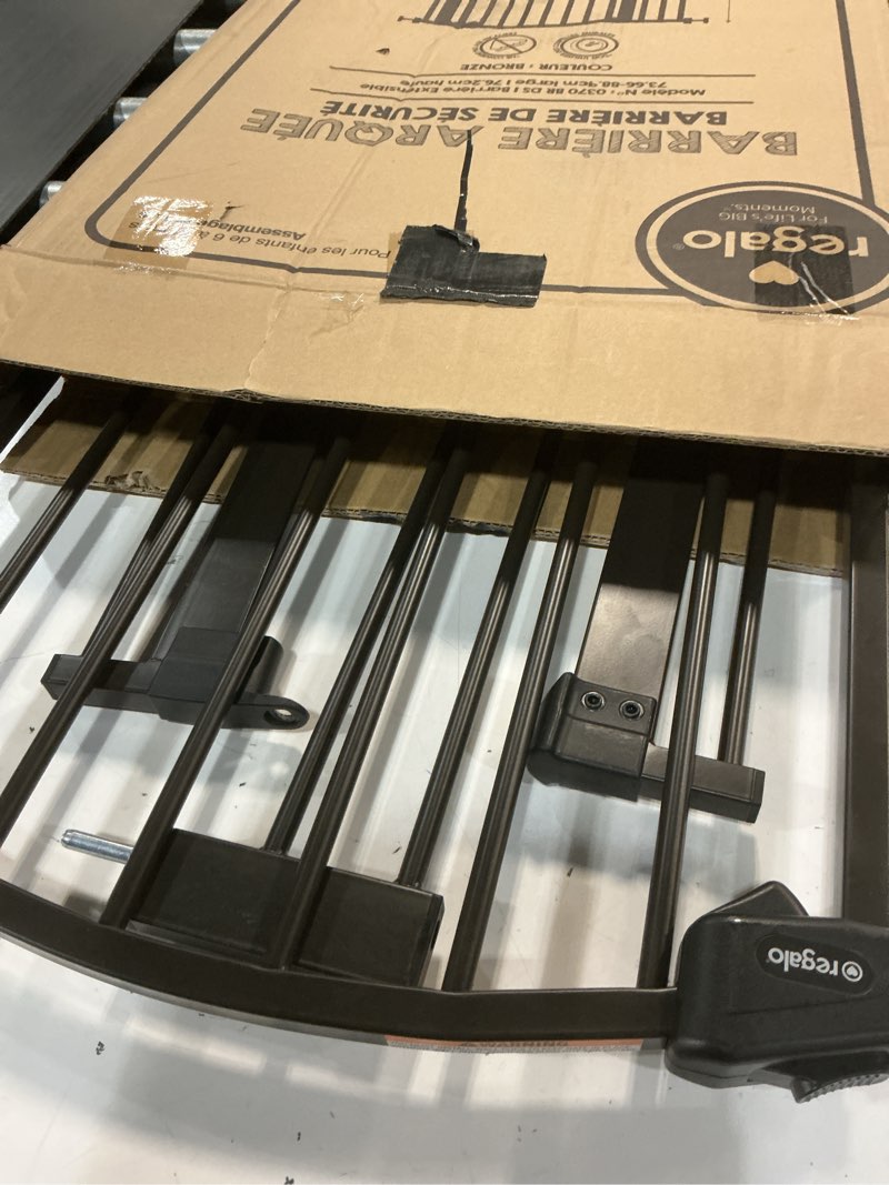 Condition photo showing Good Condition for regalo 35-inch home accents super wide walk through baby gate, includes 4-inch, 8-inch and 12-inch extension, 4 pack of pressure mounts and 4 pack of wall cups and mounting kit bronze - 29-35"w x 30"h