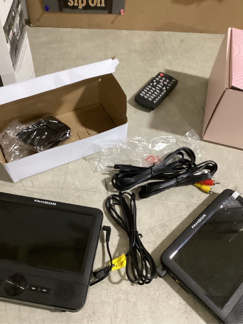 Condition photo showing As Is for doesnt power on fangor 7.5 inch dual car dvd player, portable headrest video player for car with 5 hours rechargeable battery, last memory, av out/in, support usb/sd/sync tv, all regions (1 player+1 lcd screen)