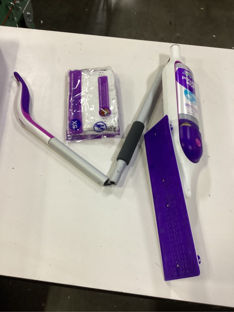 Condition photo showing As Is for swiffer powermop multi-surface mop kit for floor cleaning, includes powermop, 2 mopping pad refills, 1 cleaning solution with fresh scent and 2 batteries purple and white