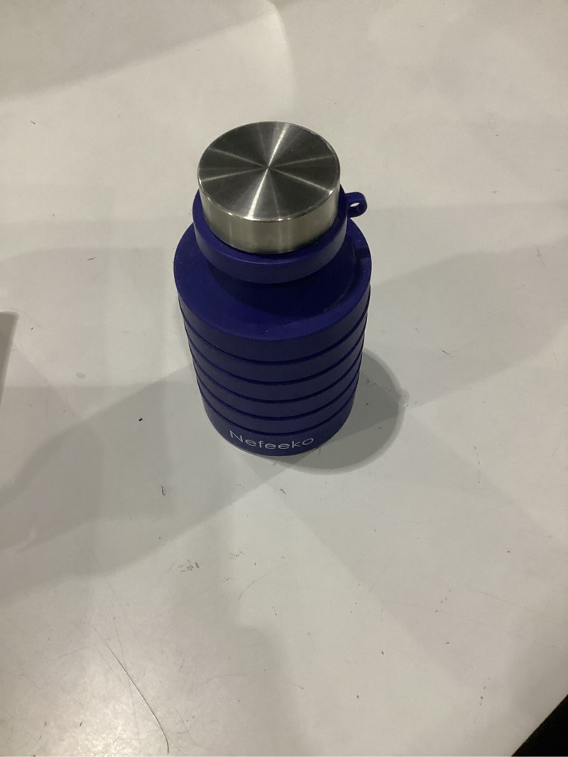 Condition photo showing As Is for nefeeko collapsible water bottle, reuseable bpa free silicone foldable water bottles for travel gym camping hiking, portable leak proof sports water bottle with carabiner navy blue-27oz