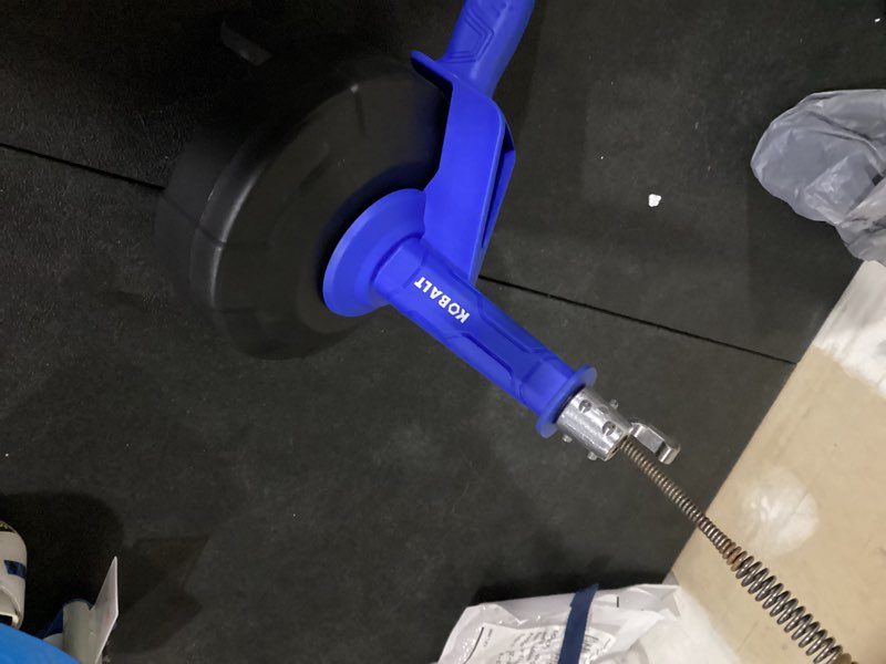 Condition photo showing As Is for cobra products 86250 1/4 in x 25 ft pistol grip power drum drain auger