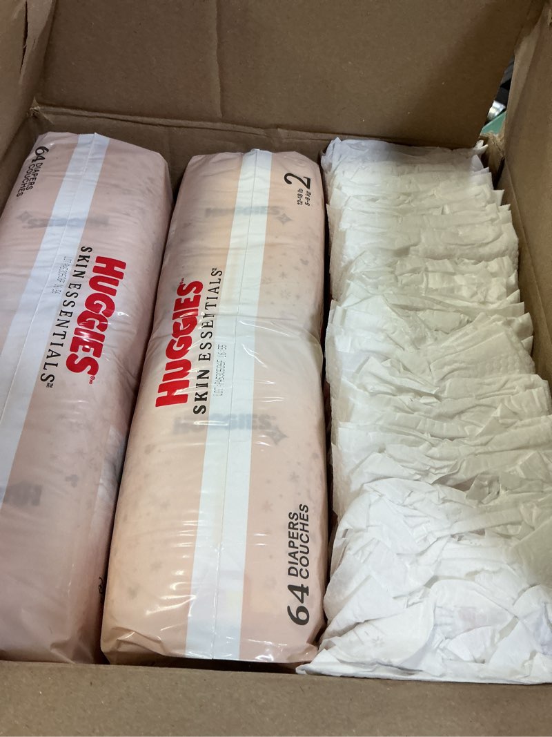 Condition photo showing As Is for huggies size 2 diapers, skin essentials baby diapers, size 2 (12-18 lbs), 192 count (3 packs of 64), packaging may vary size 2 192