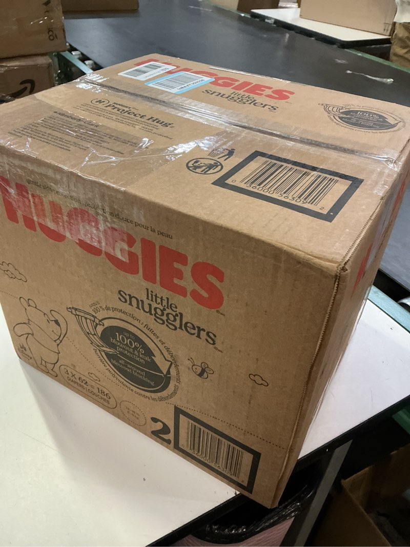 Condition photo showing New/Like New for huggies size 2 diapers, little snugglers baby diapers, size 2 (12-18 lbs), 186 count (3 packs of 62), packaging may vary