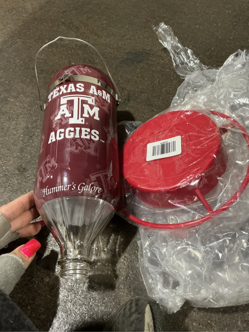 Condition photo showing New/Like New for Hummer's Galore, NCAA College Football Hummingbird Feeder, Glass Hummingbird Feeder with UV Resistant Plastic Wrap for Outdoors Hanging, 32 oz, (Texas A&M)