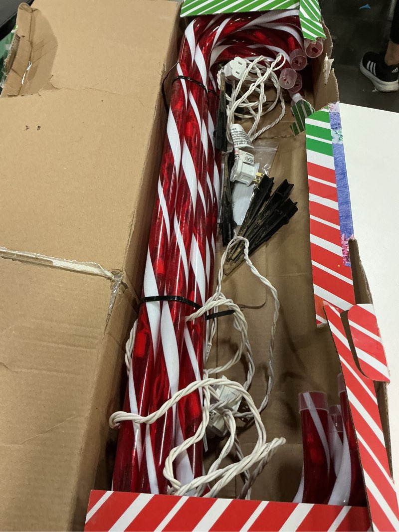 Condition photo showing As Is for 26" Christmas Candy Cane Pathway Markers Lights,18Ft Total Lenghth with 100 Lights, 10 Pack 26 Inch Candy Cane Lights(Red-White) for Christmas Decorations Red 26 inch