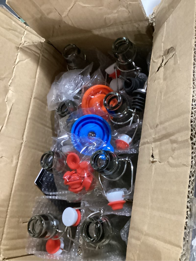 Condition photo showing Good Condition for 8 pack [1 l / 33 fl. oz.] swing top glass bottles w/ airtight stopper lids – flip top brewing bottle for fermentation, kombucha, mead, vinegar, beer, kefir, wine, soda – with 8 extra seals & 2 pourer