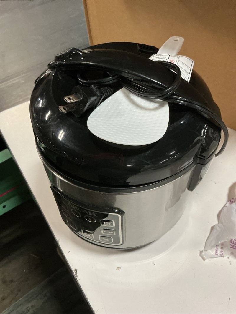 Condition photo showing As Is for aroma digital rice cooker, 4-cup (uncooked) / 8-cup (cooked), steamer, grain cooker, multicooker, 2 qt, stainless steel exterior, arc-914sbd 4 cup uncooked / 8 cup cooked