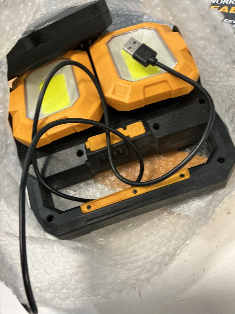 Condition photo showing As Is for yzoni 40w rechargeable led work light 4000 lumens, cordless magnetic spotlight with stand, battery powered portable light for working on cars, truck bed, garage, auto mechanic & workshop modern