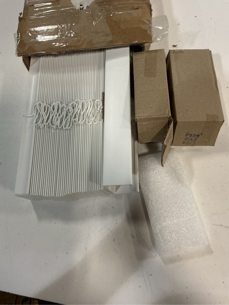 Condition photo showing As Is for chicology 2" cordless faux wood blinds, room darkening smooth pvc window blinds, cordless lift, light control and privacy, inside/outside mount, moisture resistant, basic white, 18" w x 72" h 18"w x 72"h basic white