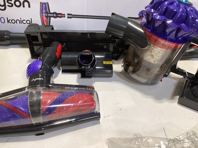 Condition photo showing As Is for dyson v10 cordless stick vacuum 9.8" cleaning path blue/black