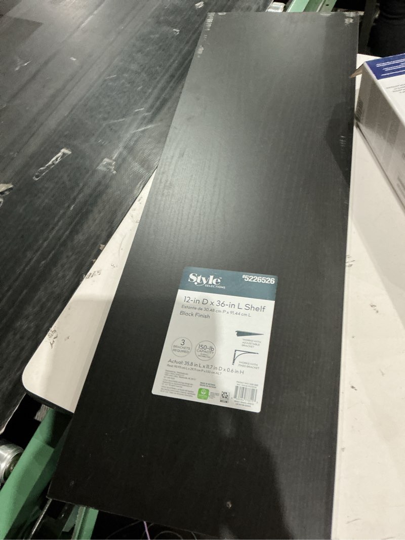 Condition photo showing As Is for 5226526  selections fions  12-in d x 36-in l shelf  estante de 30.48 cm p x 91.44 cm l  black finish  3  brackets requir uired  150-lb capacity  works with  actual: 35.8 in l x 11.7 in d x 0.6 in h real 9093 cm lx 29.71 cm px152 cm alt