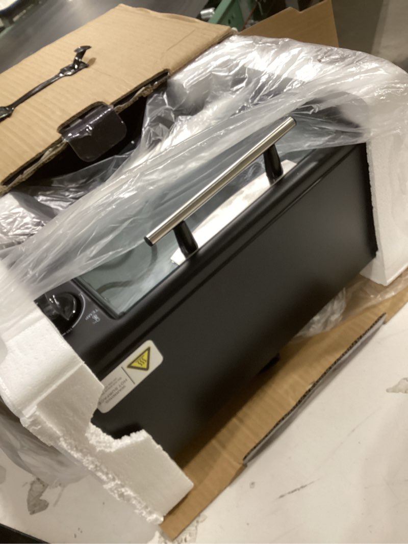 Condition photo showing Good Condition for OVENTE 8L Countertop Toaster Oven with 60-Minute Timer, Adjustable Temperature Control, Easy-to-Clean Baking Pan, 750W Compact Mini for Pizza, Toast, Bake, and Broil, Black TO2808B