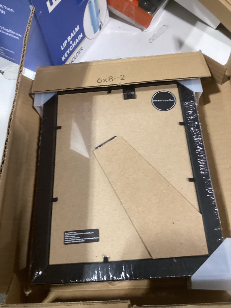 Condition photo showing New/Like New for Americanflat 6x8 Picture Frame with Shatter-Resistant Glass - Set of 2 - Use as 4x6 Frame with Mat or Display 6x8 Photo Without Mat - Signature Collection - Picture Frames for Tabletop or Wall - Black Black 6x8 2 Pack
