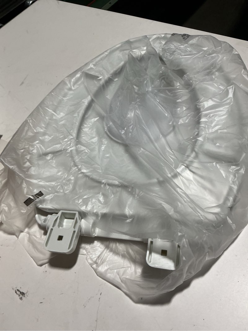 Condition photo showing As Is for Mayfair Little2Big? Elongated Plastic Toilet Seat in White with STA-TITE? Seat Fastening System? and Whisper•Close? Hinge