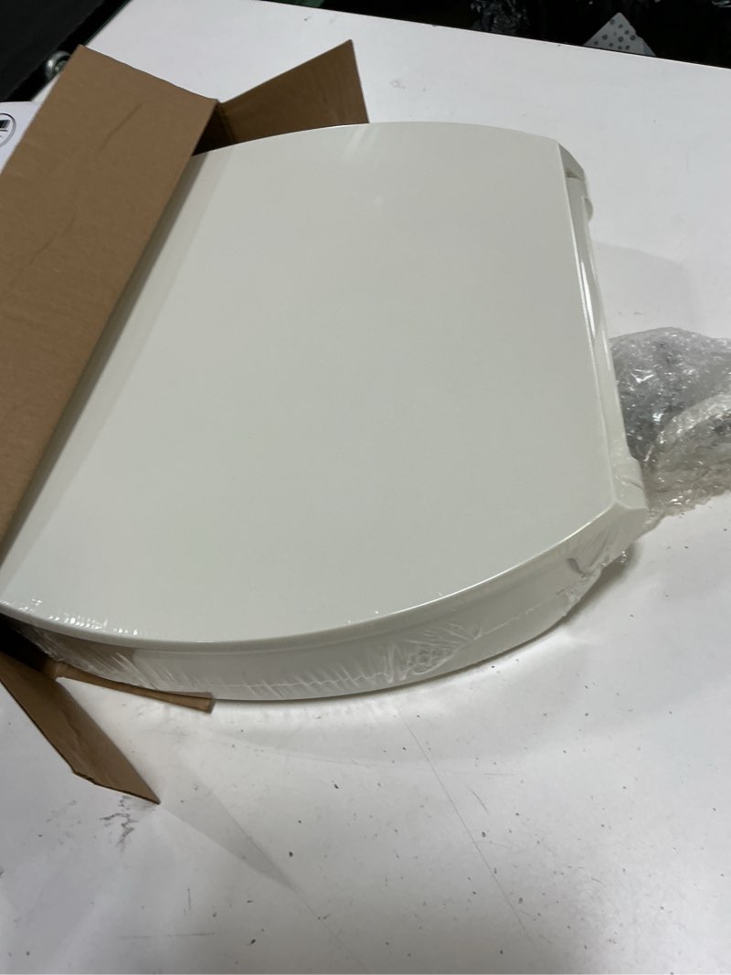 Condition photo showing Good Condition for kohler 25875-96 hyten 3" height, elevated soft close elongated toilet seat, contoured seat with grip-tight bumpers, quick-attach hardware, no slam toilet seat, biscuit biscuit elongated
