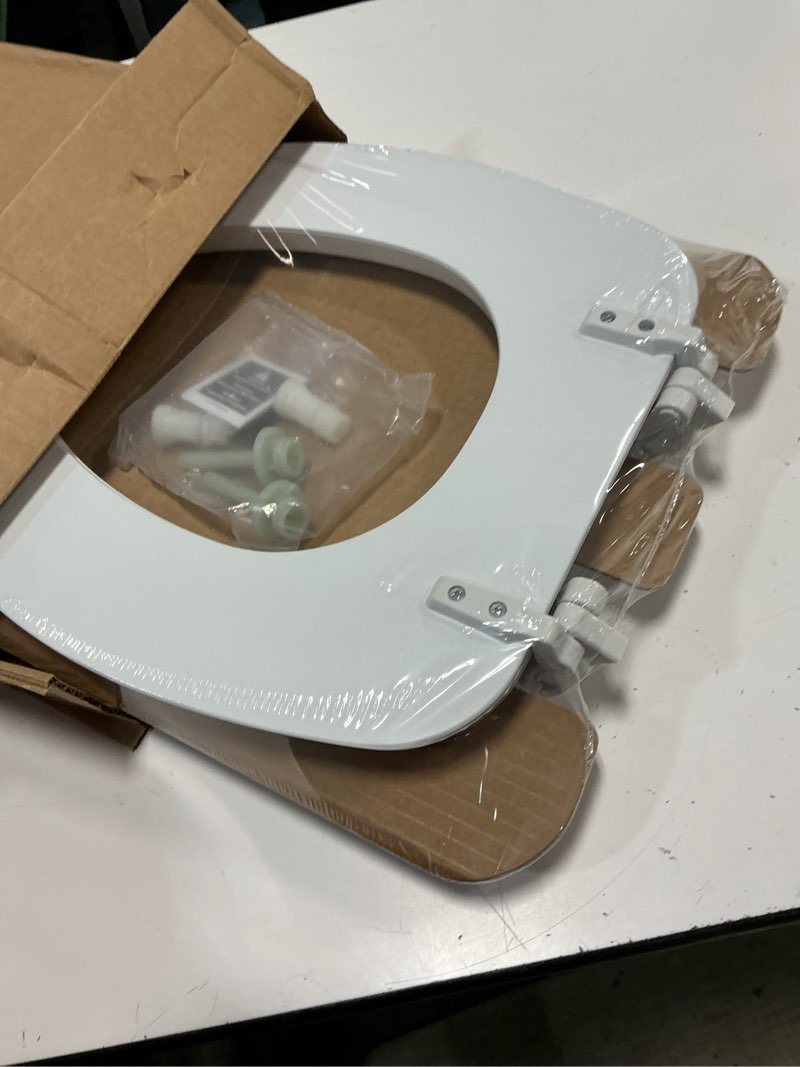 Condition photo showing New/Like New for mayfair padded toilet seat, cushioned soft vinyl over wood core seat, secure hinges, easy clean, made in usa, elongated, white elongated white toilet seat