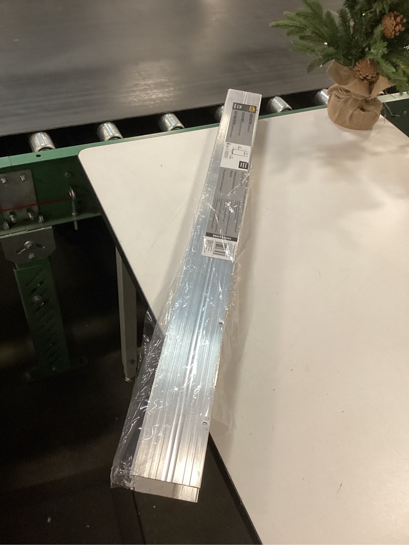 Condition photo showing As Is for M-D Building Products 68593 Aluminum and Vinyl U-Shape Screw-on Under Door Seal with Kick Plate Draft Stopper, Prevents Dust & Insects, Energy-Saving Door Insulation, Ideal for Home (36 Inch, Silver)