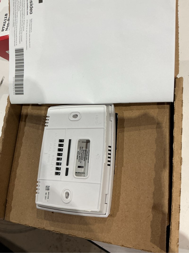 Condition photo showing As Is for honeywell rth111b1016/a non-programmable thermostat