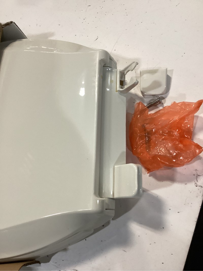 Condition photo showing As Is for kohler k-7315-96 cachet quick-release elongated toilet seat, quick attach hardware, easy to clean, color-matched plastic hinges, biscuit elongated biscuit