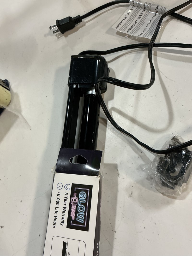 Condition photo showing As Is for archipelago lighting 24" black light bulb with 28" mountable fixture - 17 watts