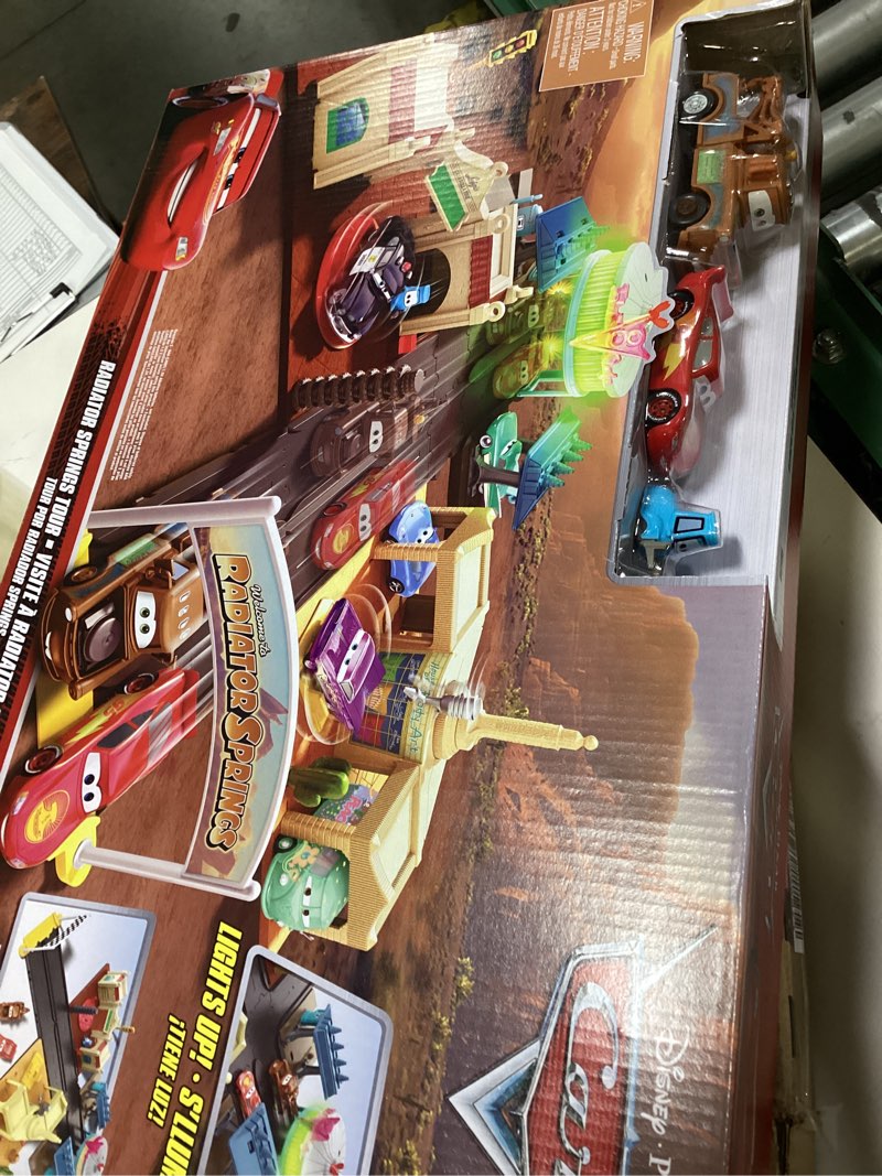 Condition photo showing New/Like New for mattel disney and pixar cars on the road playset with 2 toy vehicles & light-up countdown, includes lightning mcqueen & mater truck