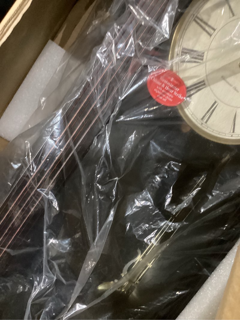 Condition photo showing As Is for Howard Miller Gobles Wall Clock, Analog Display Brown Unique Style Swinging Pendulum Clocks with Black Finished | White Dial Quartz Movement Perfect for Bedroom, Home Decor and Office